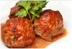 Italian Meatballs with juice running and garnished with parsley